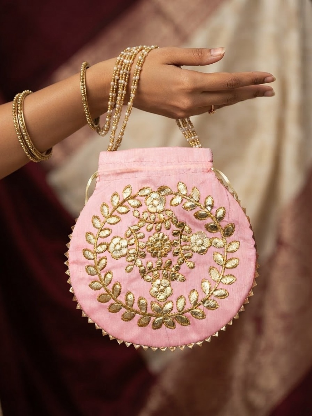 Embroidered Pink Potli Bag with Gold Motif